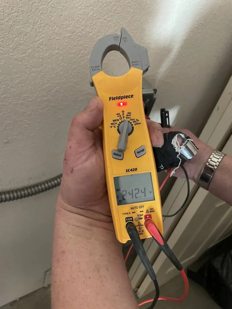 Voltage testing with clamp meter during Generator Installation in Griffin